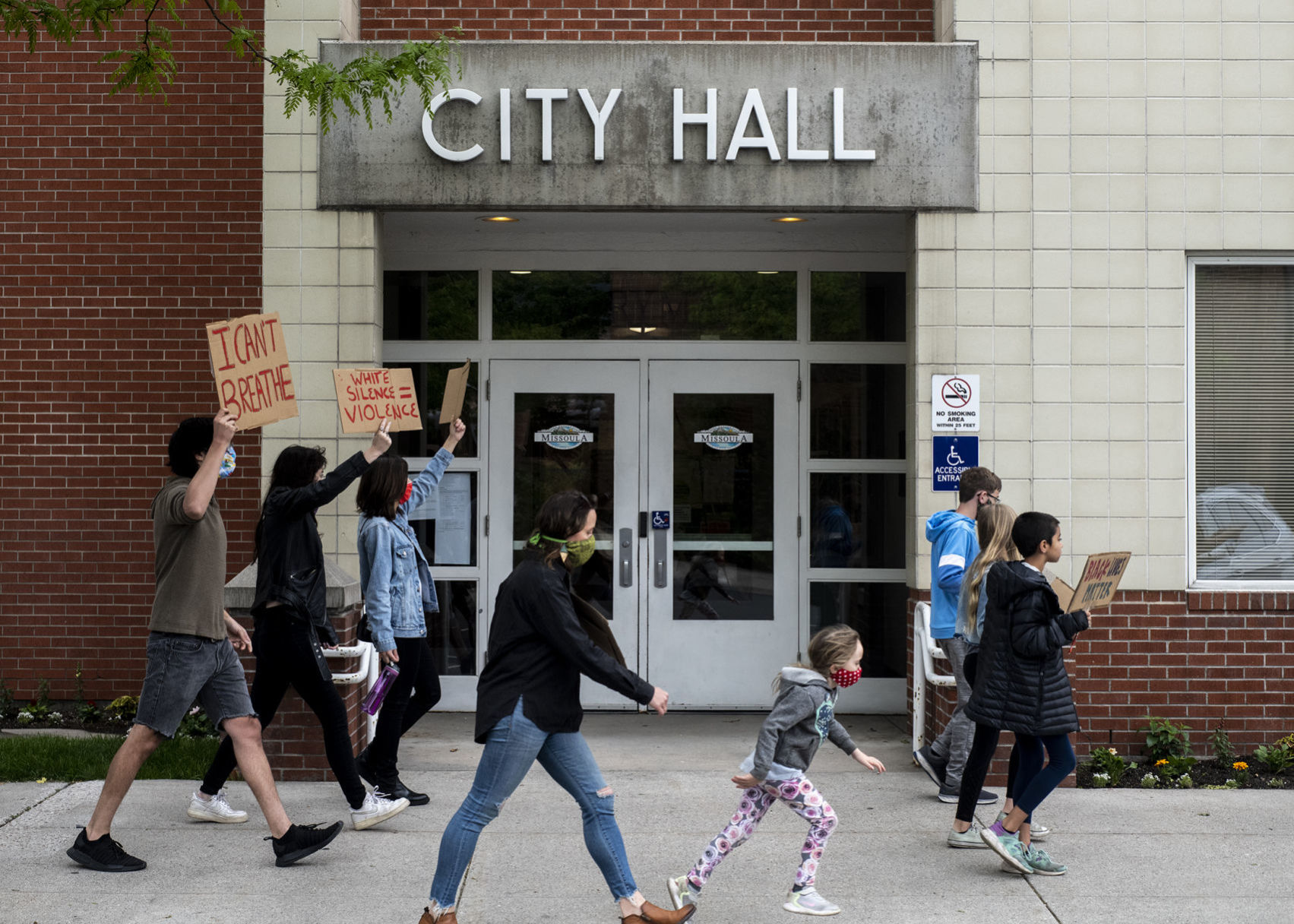 Marching past City Hall